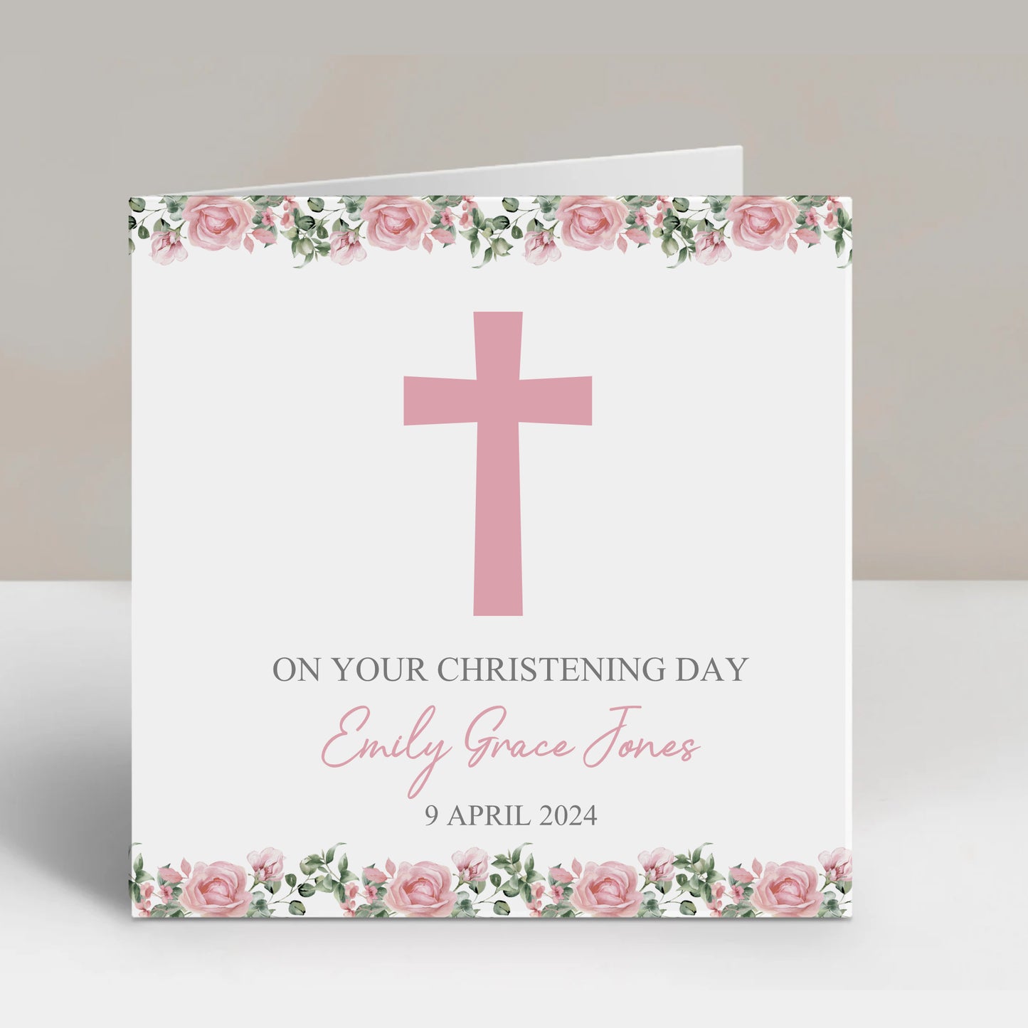a card with a pink cross on it