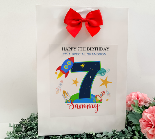 a birthday card with a red bow on it