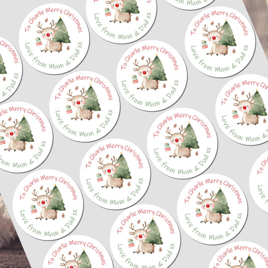 Set of personalized Christmas stickers with reindeer and trees on a white background