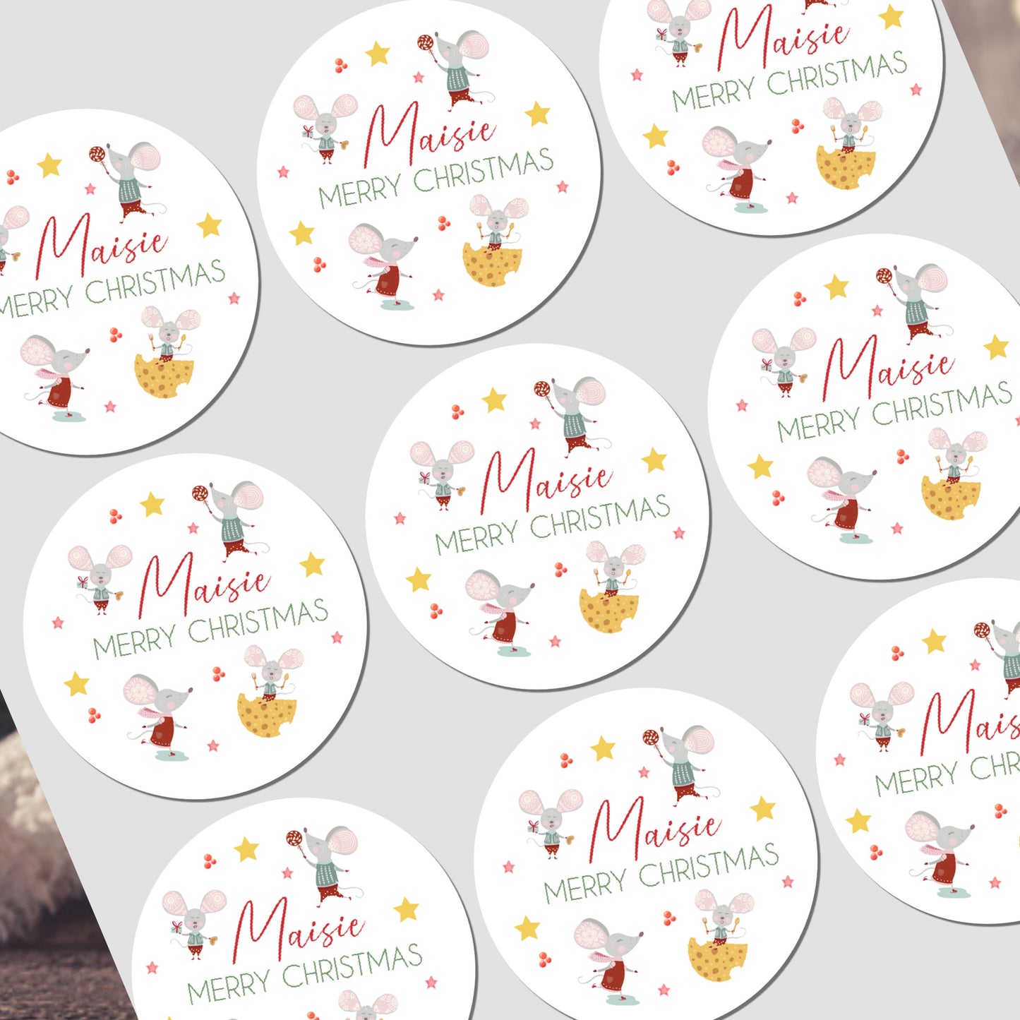 Circular Christmas stickers with cartoon mice design on a white background