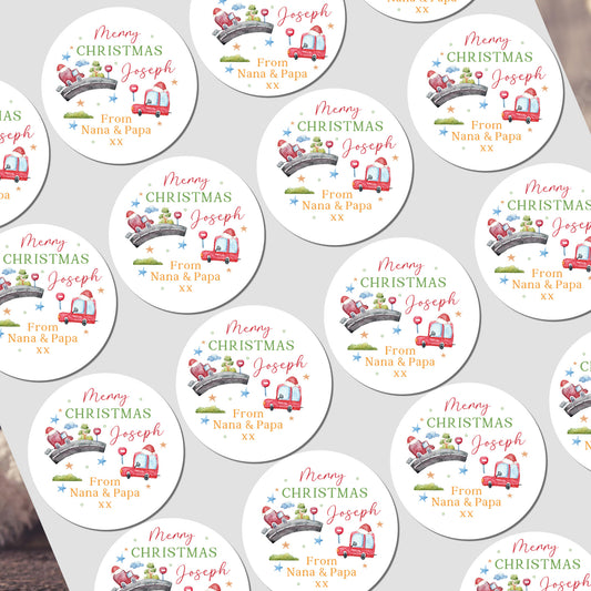 Collection of personalized Christmas stickers with festive designs on a white background.