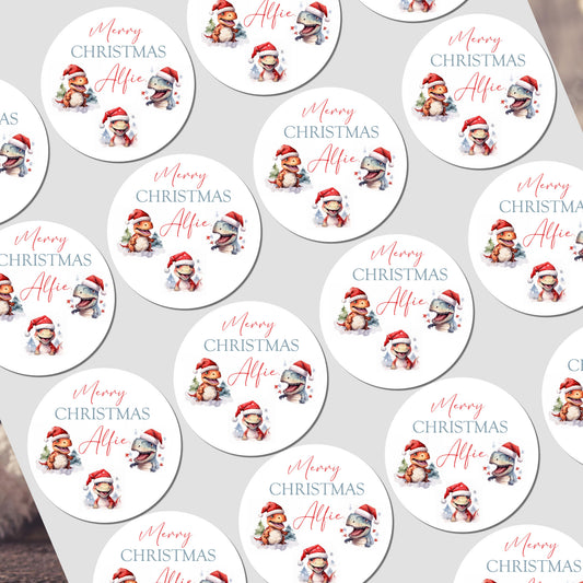 Multiple personalized Christmas stickers with a child's name on a white background