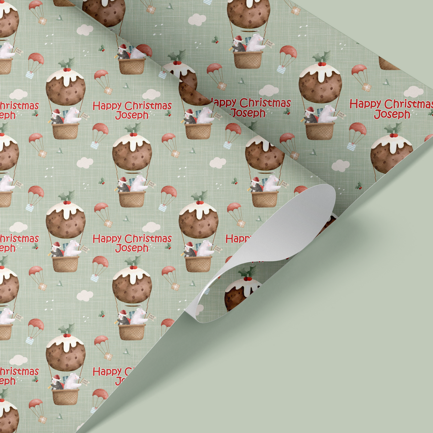 christmas wrapping paper with penguin and polar bear in christmas pudding hot air balloon