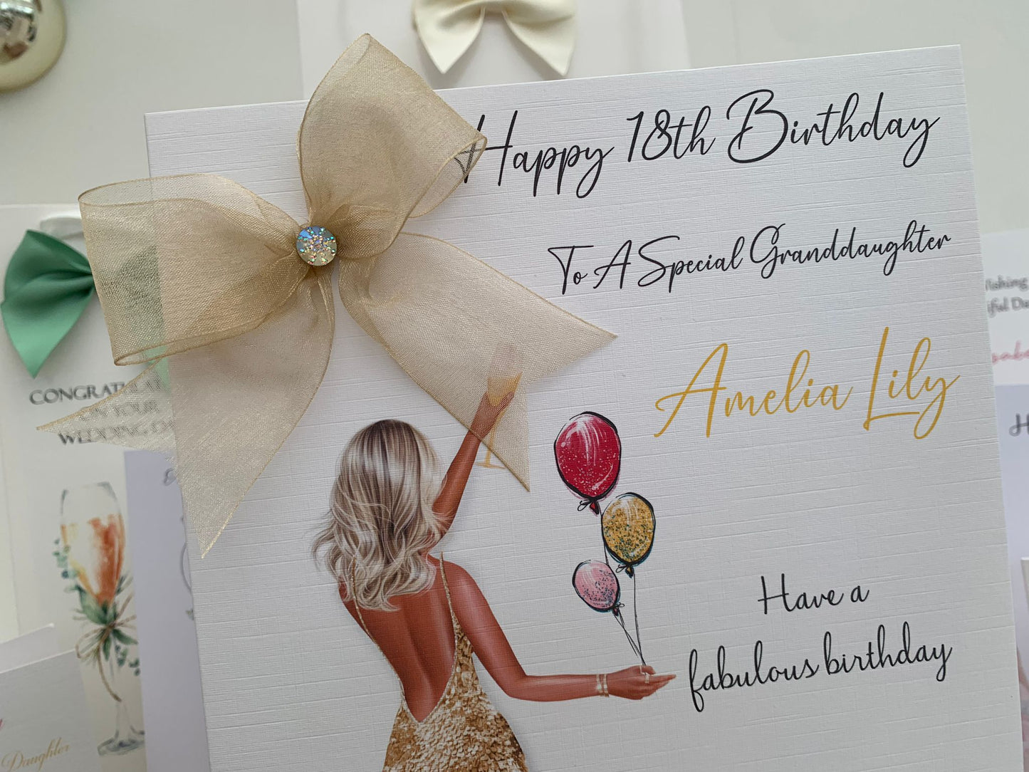 a birthday card with a picture of a woman holding balloons