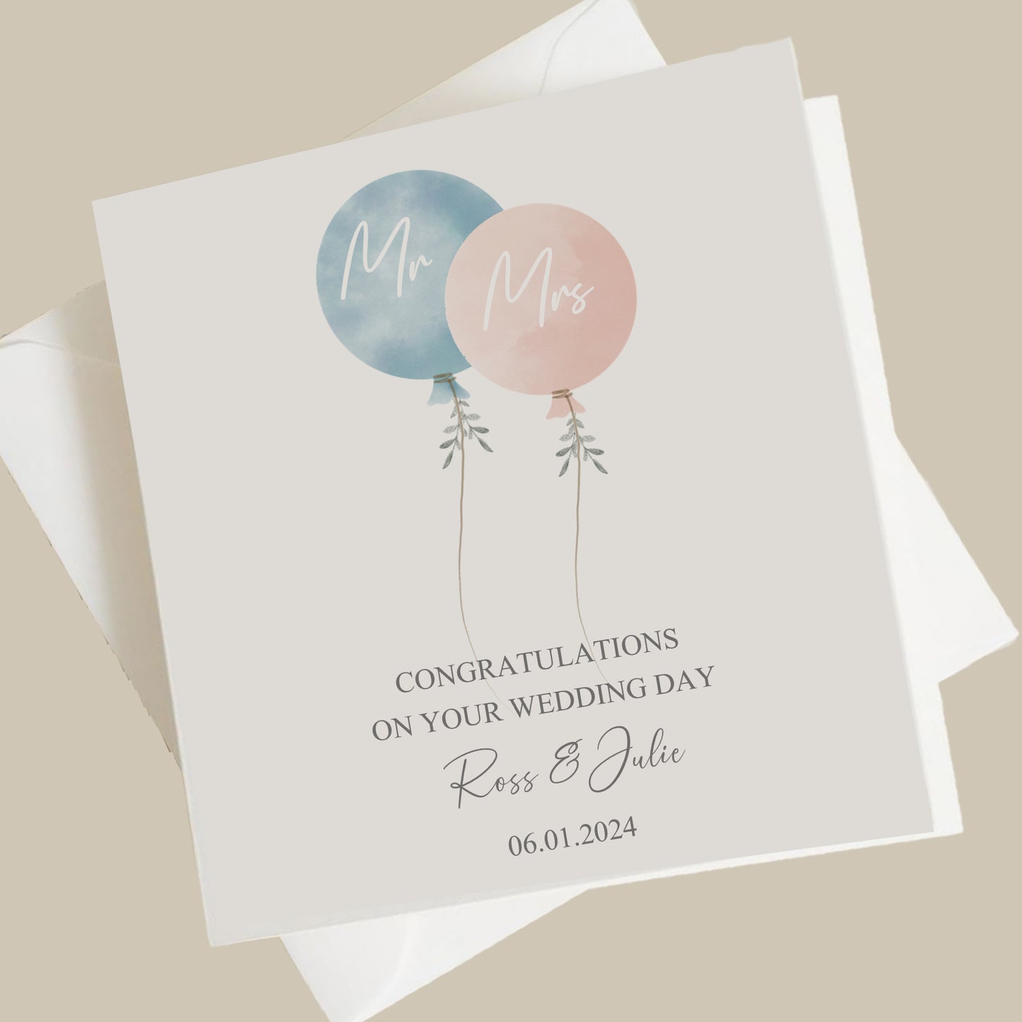 a couple of balloons on top of a card