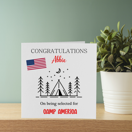 a greeting card with an american flag and a tent