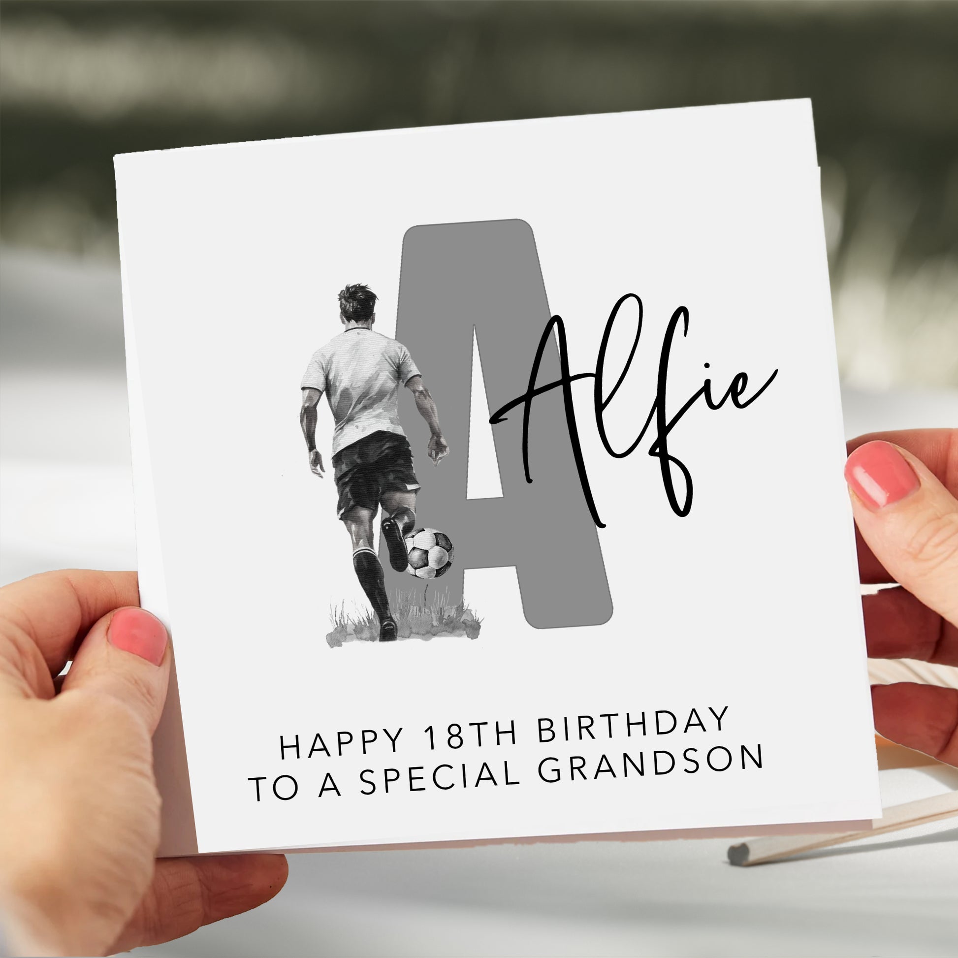 a person holding a card with a picture of a man and a dog