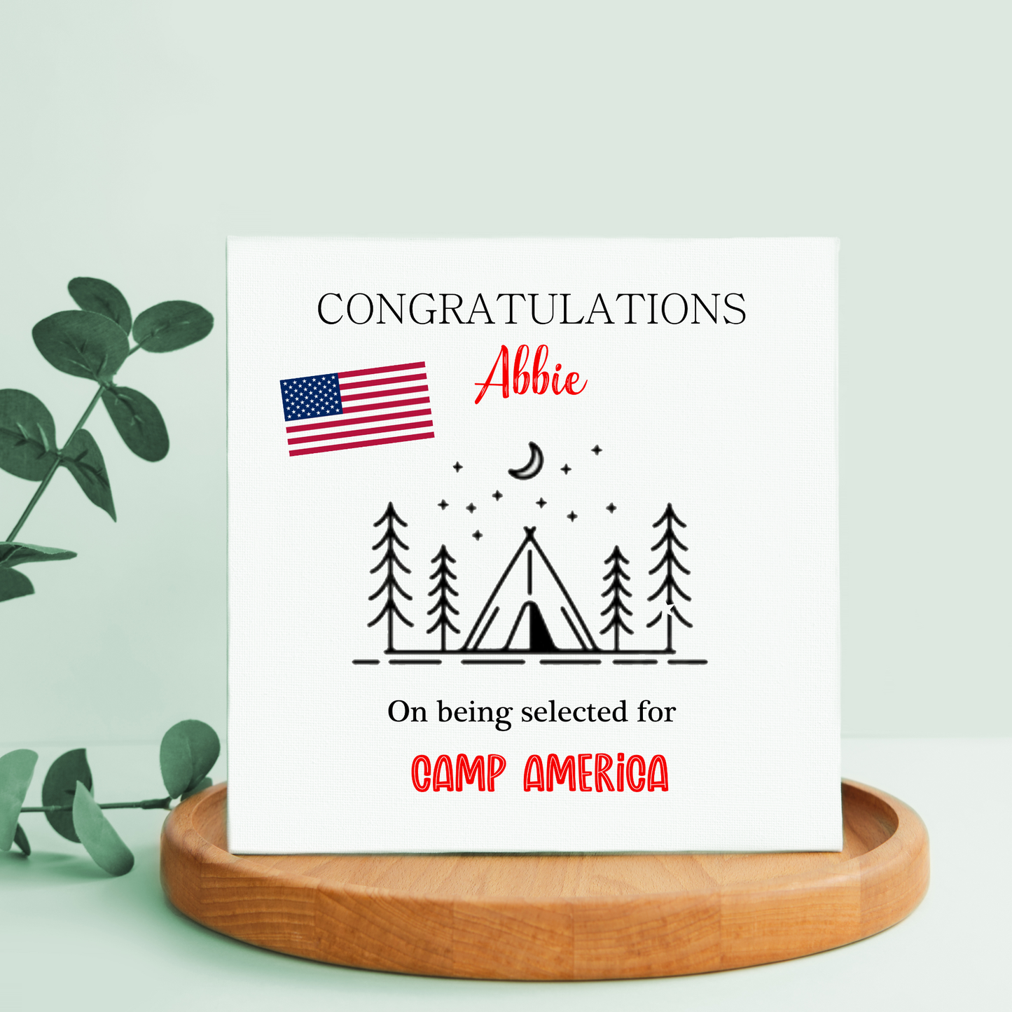 a greeting card with an american flag and a tent