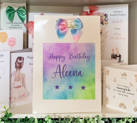 a birthday card with a bow on top of it