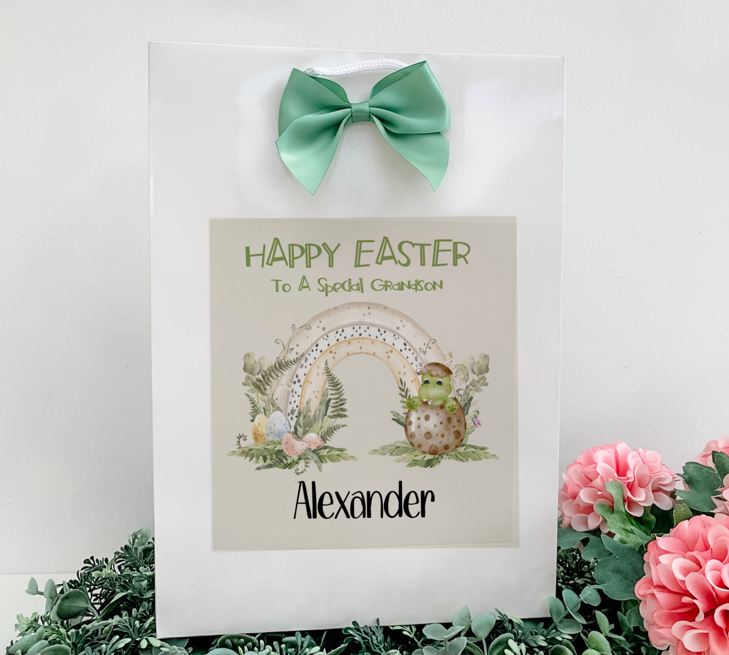 a picture of an easter card with a green bow