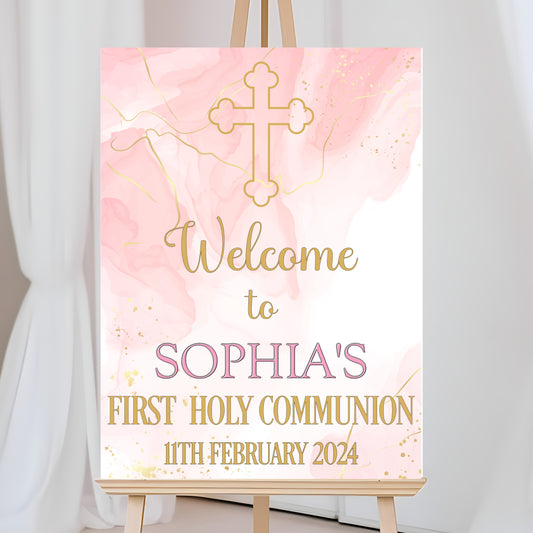 a pink and gold welcome sign with a cross on it