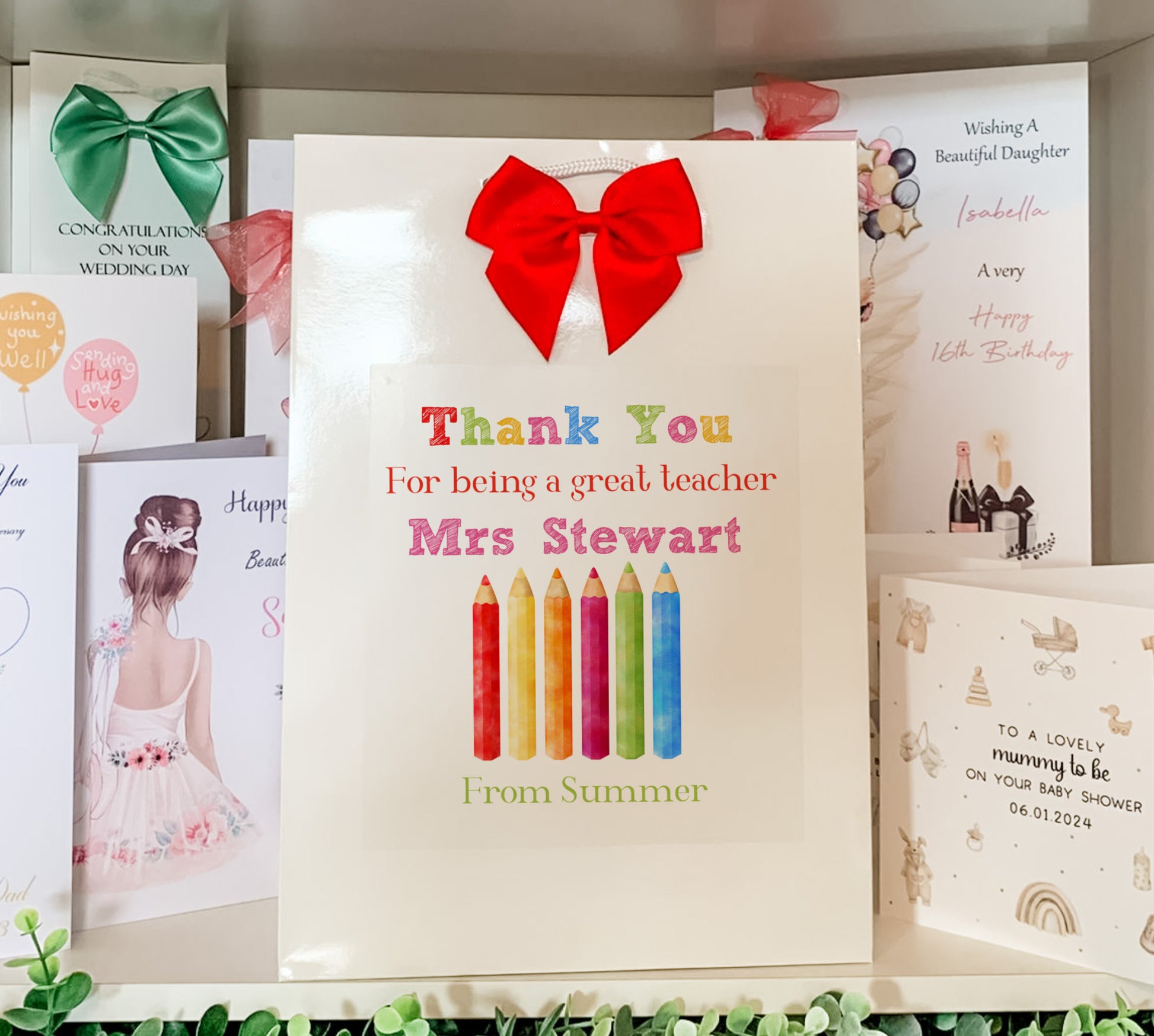 a bunch of greeting cards are on a shelf