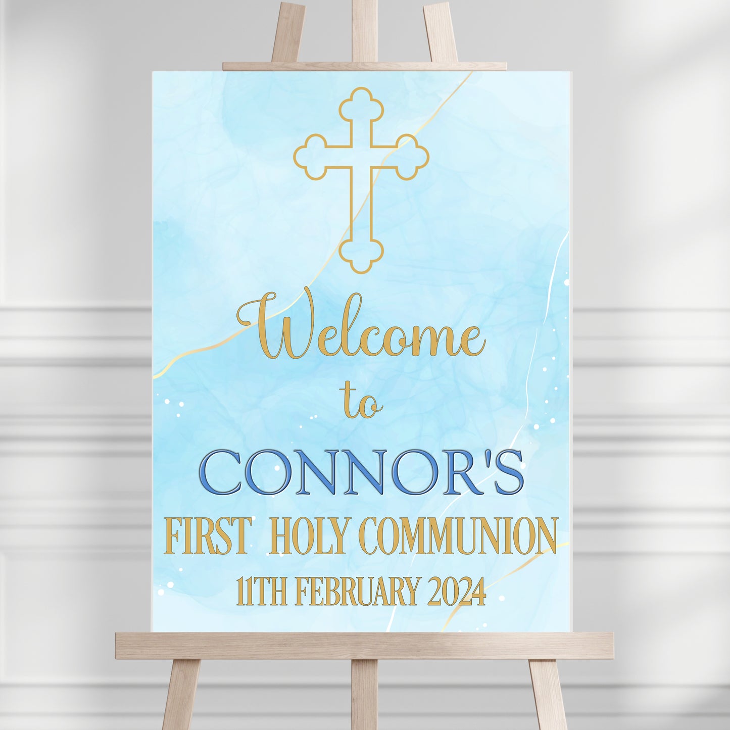 a wooden easel with a sign that says welcome to connor's first holy