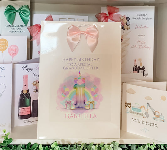 a birthday card with a pink bow on it
