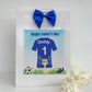 a father's day card with a soccer jersey and a blue bow