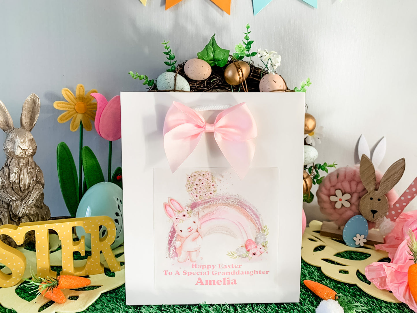 a greeting card with a pink bow on top of it