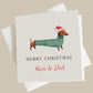 a christmas card with a dachshund wearing a santa hat