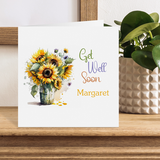 a card with a picture of a vase of sunflowers
