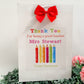 a thank you card with a red bow on it