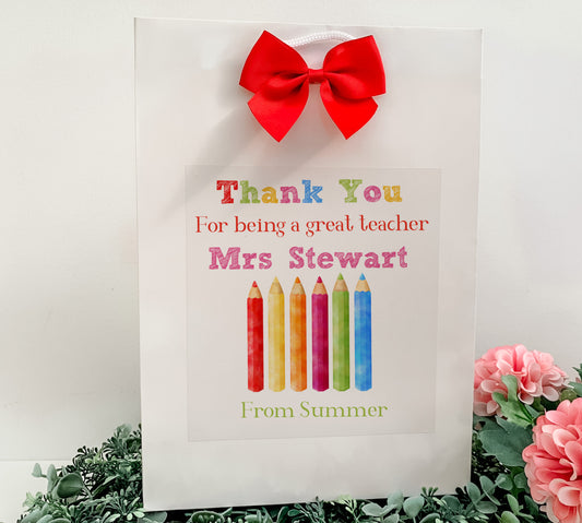 a thank you card with a red bow on it