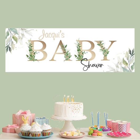 a baby shower banner with a cake and cupcakes