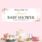 a baby shower party with a cake and cupcakes