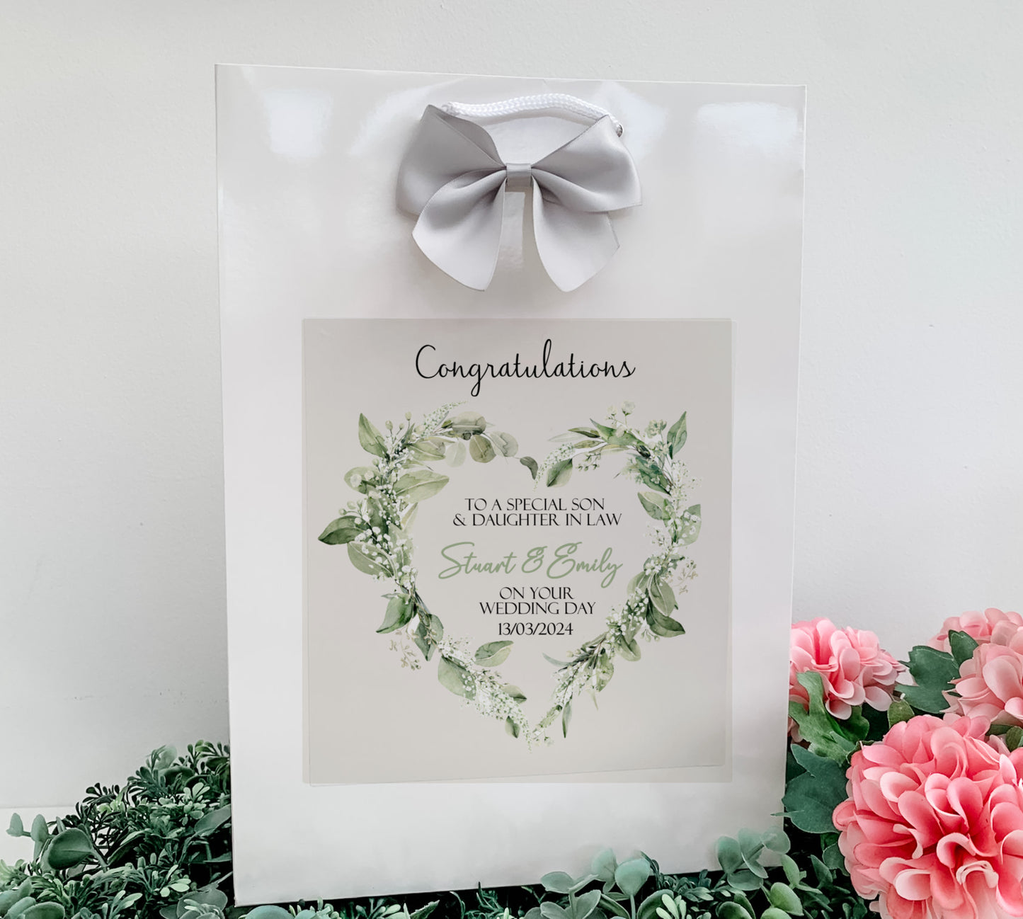 a picture frame with a heart and flowers on it