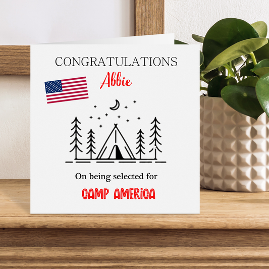 a greeting card with an american flag and a tent
