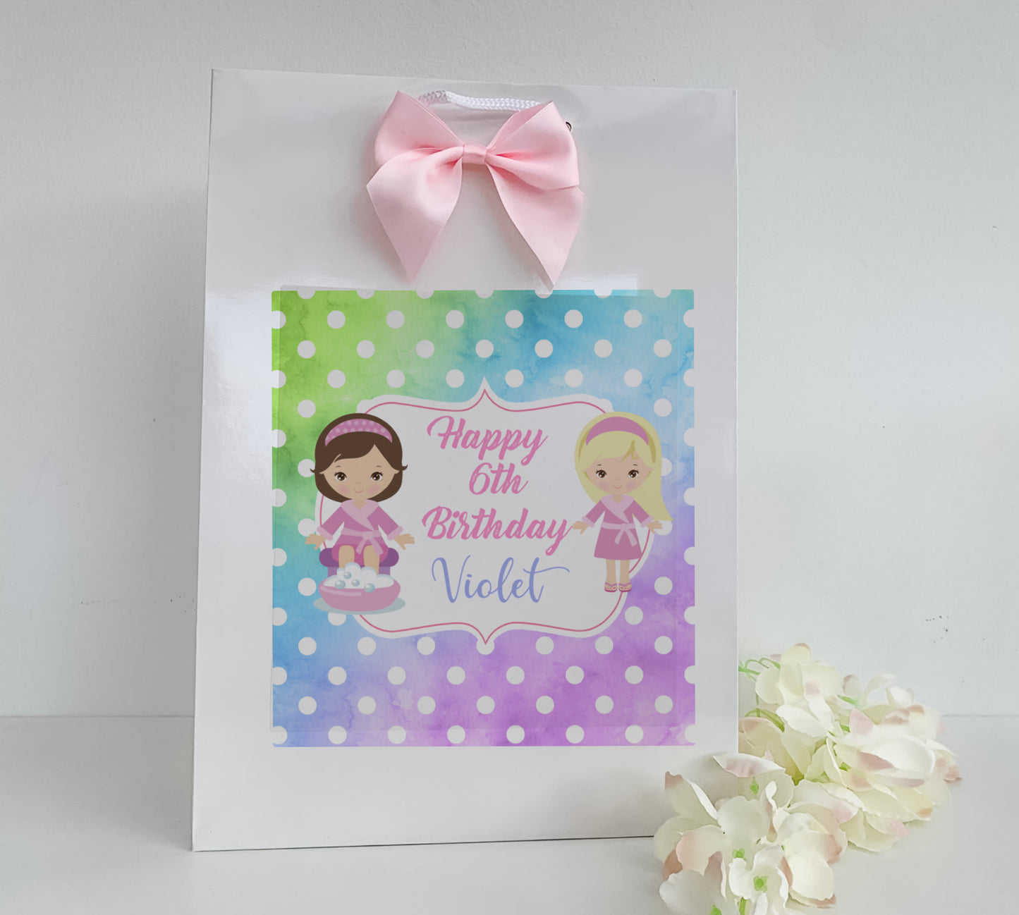 a birthday bag with a picture of two girls on it