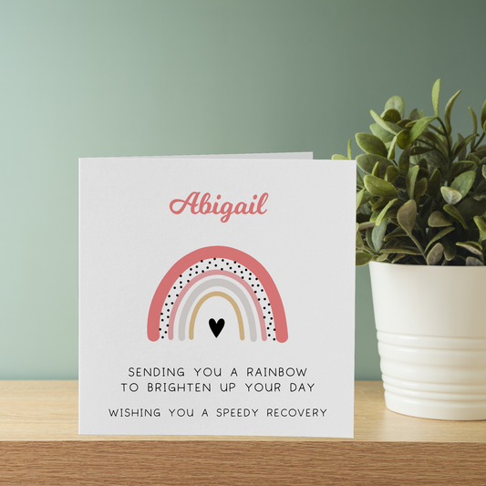 a card with a rainbow and a heart on it