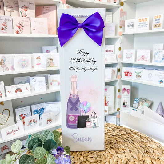 a birthday card with a purple bow on it