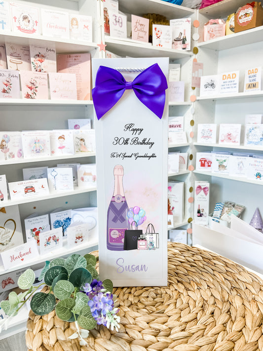 a birthday card with a purple bow on it