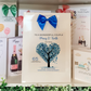 a couple of cards are on a shelf