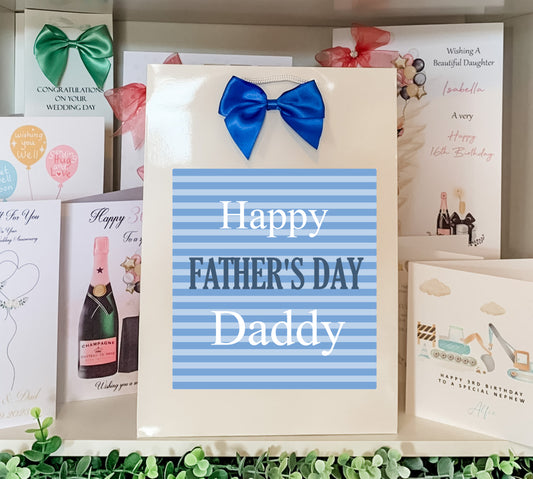 a father's day card with a blue bow on it