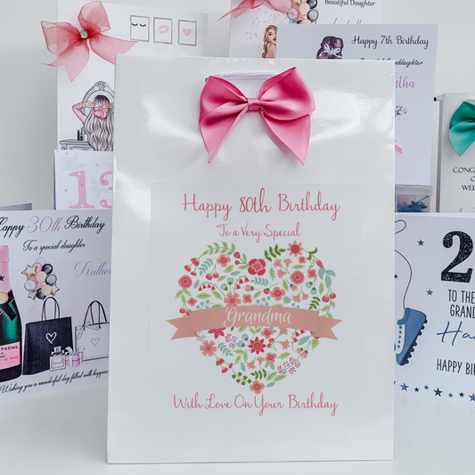 a birthday card with a pink bow on it