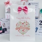 a birthday card with a pink bow on it