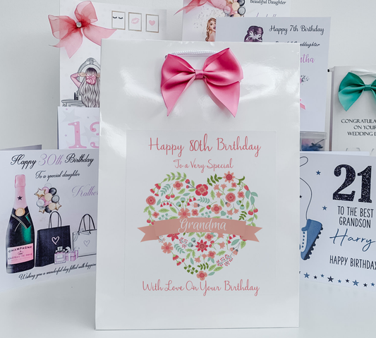 a birthday card with a pink bow on it