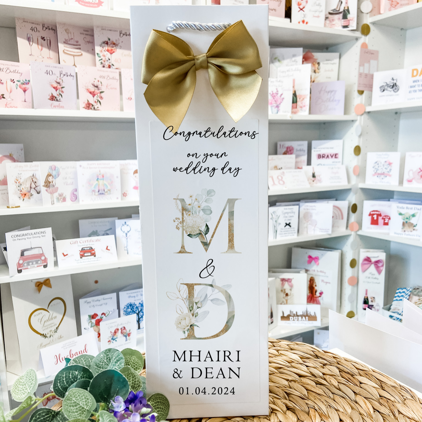 a card with a bow on top of a table