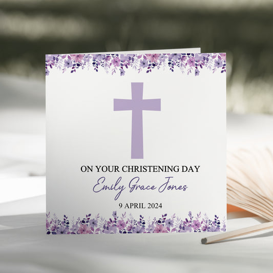 a card with a cross on it sitting on a table