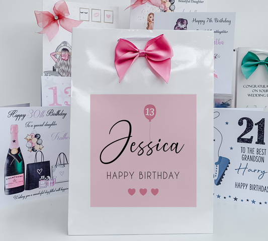 a birthday card with a pink bow on it