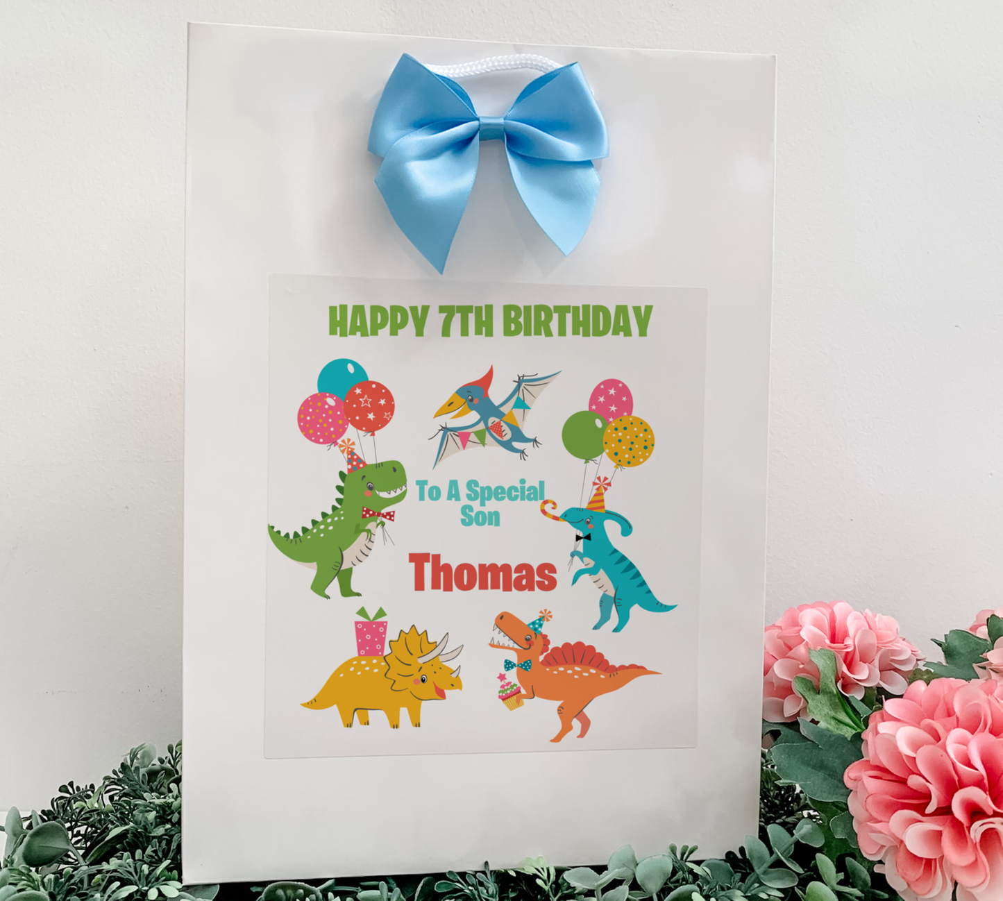 a picture of a birthday card with dinosaurs and balloons