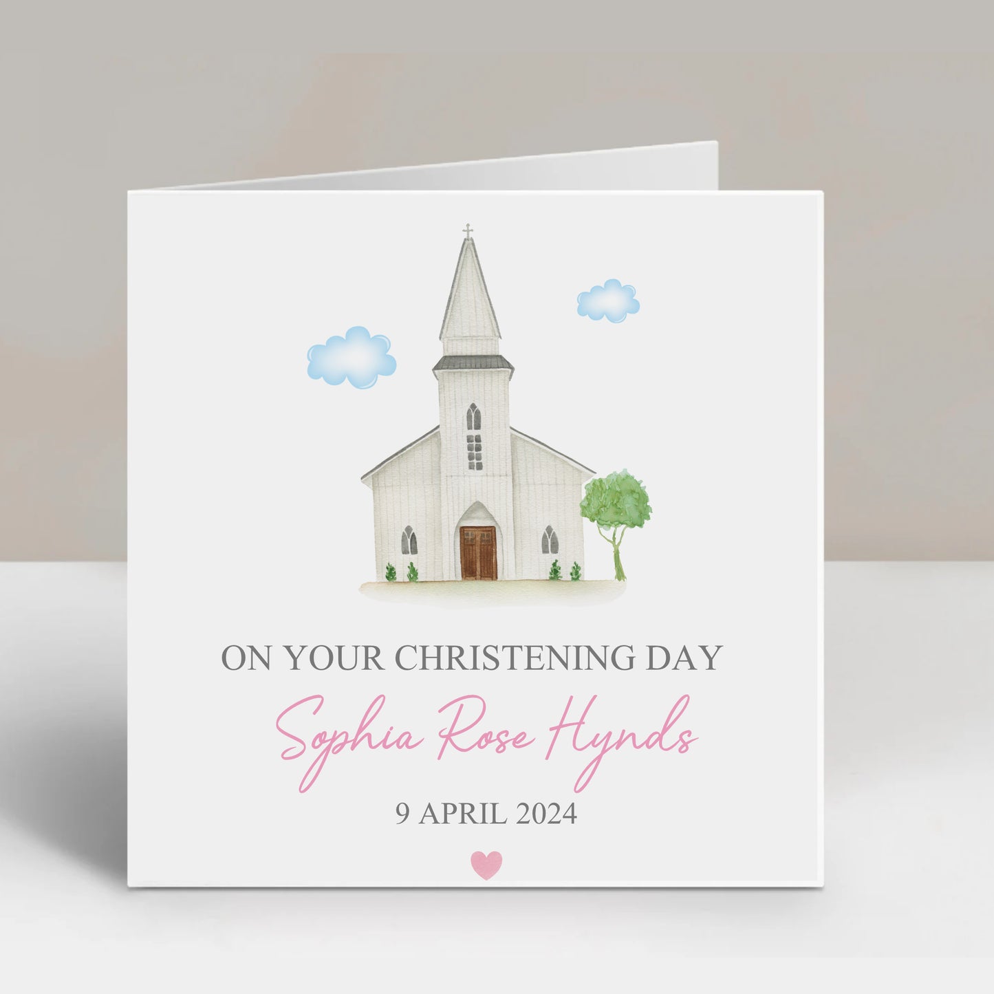 a white card with a church on it