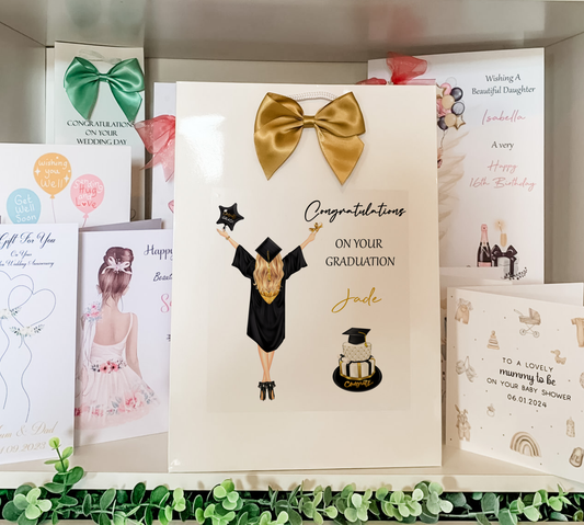 a card with a picture of a girl in a graduation outfit