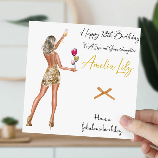 a woman holding up a birthday card with an image of a woman holding a rose