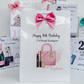 a birthday card with a pink purse and a pink bow
