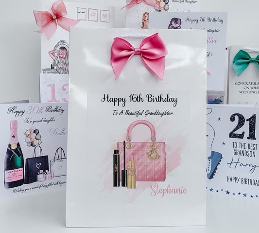 a birthday card with a pink purse and a pink bow