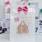 a birthday card with a pink bow on it