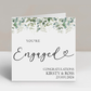 a card with the words engaged written on it