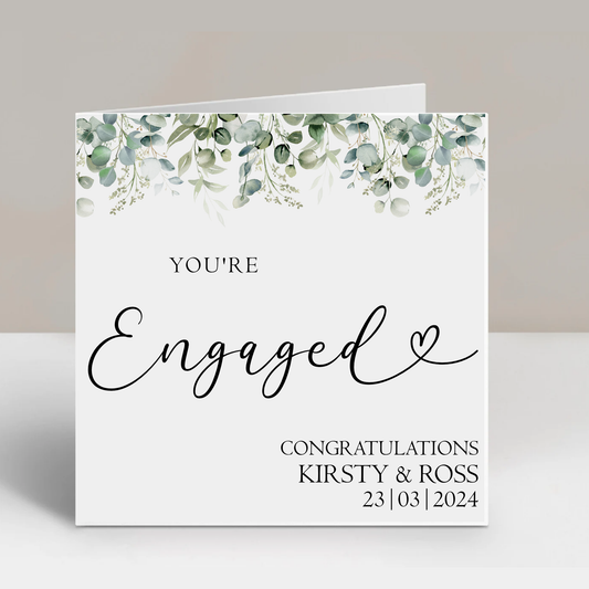 a card with the words engaged written on it