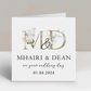 a wedding card with the letter m and d on it